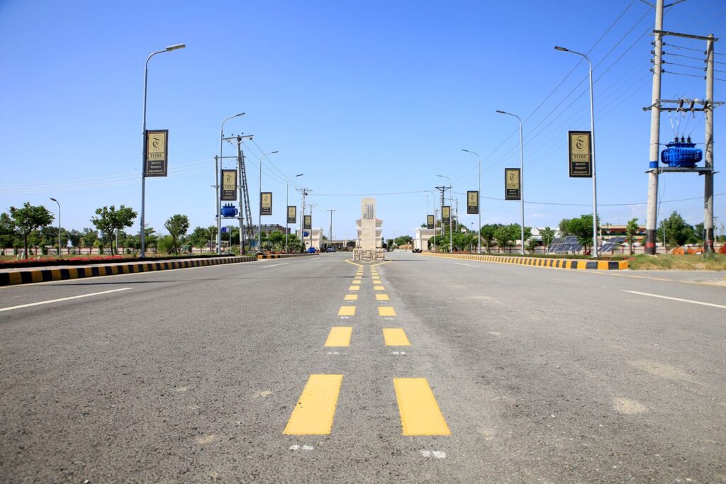 A wide double road through Green Mansions