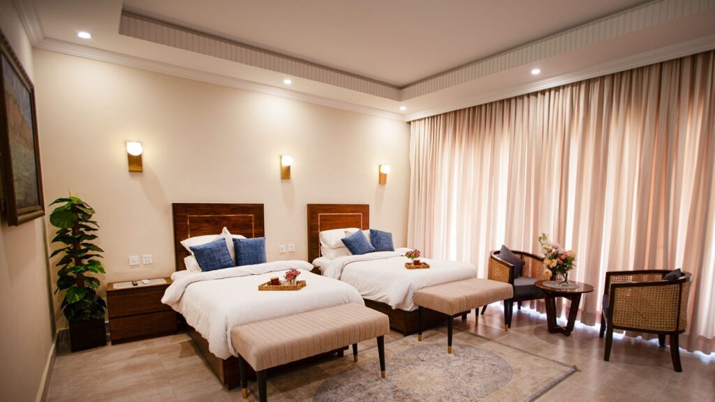 A twin room with garden-view windows