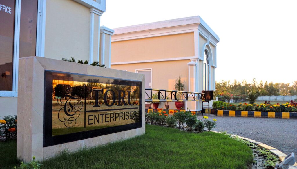 The Toru Enterprises sign at the entrance of Green Mansions